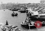 Image of natives in city Singapore, 1937, second 12 stock footage video 65675043495