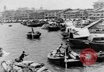 Image of natives in city Singapore, 1937, second 13 stock footage video 65675043495