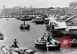 Image of natives in city Singapore, 1937, second 14 stock footage video 65675043495