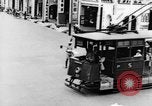 Image of natives in city Singapore, 1937, second 15 stock footage video 65675043495