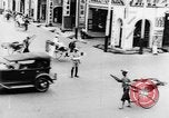 Image of natives in city Singapore, 1937, second 24 stock footage video 65675043495