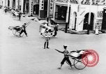 Image of natives in city Singapore, 1937, second 25 stock footage video 65675043495