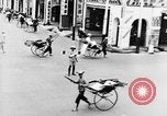 Image of natives in city Singapore, 1937, second 26 stock footage video 65675043495
