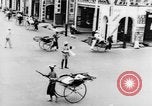 Image of natives in city Singapore, 1937, second 27 stock footage video 65675043495