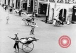 Image of natives in city Singapore, 1937, second 28 stock footage video 65675043495