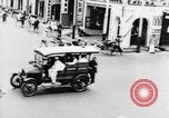 Image of natives in city Singapore, 1937, second 29 stock footage video 65675043495