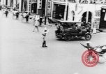 Image of natives in city Singapore, 1937, second 31 stock footage video 65675043495