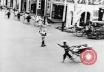 Image of natives in city Singapore, 1937, second 32 stock footage video 65675043495