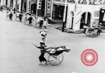 Image of natives in city Singapore, 1937, second 33 stock footage video 65675043495