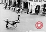 Image of natives in city Singapore, 1937, second 34 stock footage video 65675043495