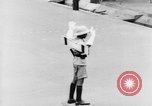 Image of natives in city Singapore, 1937, second 37 stock footage video 65675043495