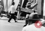 Image of natives in city Singapore, 1937, second 47 stock footage video 65675043495