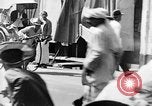 Image of natives in city Singapore, 1937, second 49 stock footage video 65675043495