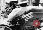 Image of natives in city Singapore, 1937, second 50 stock footage video 65675043495