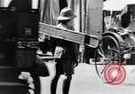 Image of natives in city Singapore, 1937, second 53 stock footage video 65675043495