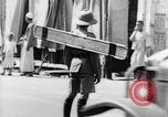 Image of natives in city Singapore, 1937, second 54 stock footage video 65675043495
