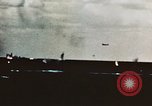 Image of USS Saratoga CV-3 struck by Kamikaze aircraft Pacific Theater, 1945, second 10 stock footage video 65675043694