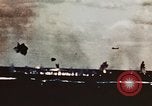Image of USS Saratoga CV-3 struck by Kamikaze aircraft Pacific Theater, 1945, second 13 stock footage video 65675043694