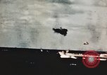 Image of USS Saratoga CV-3 struck by Kamikaze aircraft Pacific Theater, 1945, second 20 stock footage video 65675043694
