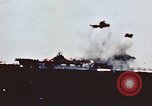 Image of USS Saratoga CV-3 struck by Kamikaze aircraft Pacific Theater, 1945, second 25 stock footage video 65675043694