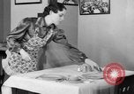 Image of office wife prepares meal Chicago Illinois USA, 1936, second 35 stock footage video 65675043759