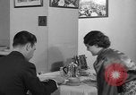 Image of office wife prepares meal Chicago Illinois USA, 1936, second 50 stock footage video 65675043759