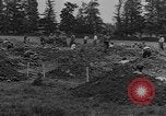 Image of German prisoners dig graves for American soldiers France, 1944, second 23 stock footage video 65675043863