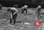 Image of German prisoners dig graves for American soldiers France, 1944, second 33 stock footage video 65675043863