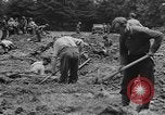 Image of German prisoners dig graves for American soldiers France, 1944, second 55 stock footage video 65675043863