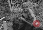 Image of German prisoners dig graves for American soldiers France, 1944, second 57 stock footage video 65675043863