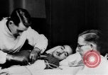 Image of wounded British soldier on stretcher United Kingdom, 1940, second 19 stock footage video 65675043882