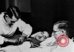 Image of wounded British soldier on stretcher United Kingdom, 1940, second 20 stock footage video 65675043882
