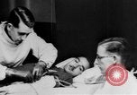 Image of wounded British soldier on stretcher United Kingdom, 1940, second 21 stock footage video 65675043882