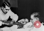 Image of wounded British soldier on stretcher United Kingdom, 1940, second 22 stock footage video 65675043882