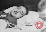 Image of wounded British soldier on stretcher United Kingdom, 1940, second 23 stock footage video 65675043882