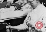 Image of wounded British soldier on stretcher United Kingdom, 1940, second 24 stock footage video 65675043882
