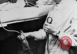 Image of wounded British soldier on stretcher United Kingdom, 1940, second 26 stock footage video 65675043882