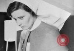 Image of wounded British soldier on stretcher United Kingdom, 1940, second 33 stock footage video 65675043882