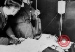 Image of wounded British soldier on stretcher United Kingdom, 1940, second 34 stock footage video 65675043882
