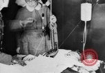 Image of wounded British soldier on stretcher United Kingdom, 1940, second 35 stock footage video 65675043882