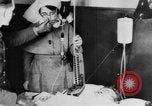 Image of wounded British soldier on stretcher United Kingdom, 1940, second 37 stock footage video 65675043882