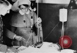 Image of wounded British soldier on stretcher United Kingdom, 1940, second 41 stock footage video 65675043882