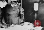 Image of wounded British soldier on stretcher United Kingdom, 1940, second 42 stock footage video 65675043882