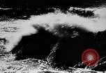 Image of ocean waves on rocky shores Vietnam, 1925, second 1 stock footage video 65675044076