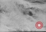 Image of ocean waves on rocky shores Vietnam, 1925, second 5 stock footage video 65675044076