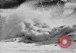 Image of ocean waves on rocky shores Vietnam, 1925, second 8 stock footage video 65675044076