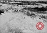 Image of ocean waves on rocky shores Vietnam, 1925, second 11 stock footage video 65675044076