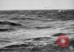 Image of ocean waves on rocky shores Vietnam, 1925, second 18 stock footage video 65675044076