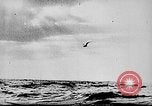 Image of ocean waves on rocky shores Vietnam, 1925, second 22 stock footage video 65675044076