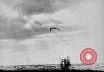Image of ocean waves on rocky shores Vietnam, 1925, second 24 stock footage video 65675044076